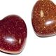 Drilled red goldstone heart pendants. $7.50 for 10 piece bag. 
