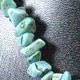 18" choker of approximately 10mm chunky style Turquoise Howlite chips with lobster claw clasp and 1.5" adjustable chain. 