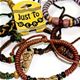 50 piece bag of adjustable wax cord bracelets with ceramic discs and beads. 