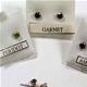 36 pair box of 4mm faceted stone earrings set in sterling silver.