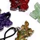 10 pc bag of assorted 25mm gemstone dragons on cord.