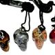 10 pc bag of assorted 25mm gemstone skulls on cord.