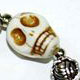 10 piece bag of natural colored magnesite skull bracelets with spacer beads. Skull bead is approximately 10mm.