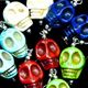 10 piece bag of colored magnesite skull earrings. Skull bead is approximately 15mm.