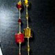 12 piece bag of assorted glass beads and gold thread necklaces. Each bag has 12 different colors of glass beads. 34" long