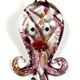 5 pc pack of octopus glass foil pendants.