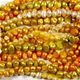 10 strand pack of yellow, gold and orange freshwater pearl strands.