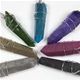 50 piece bag of wire wrapped aura crystal pendants in assorted colors.