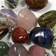 100 pc bag of 20mm assorted tumbled stone pendants.