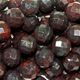 16" strand of faceted 8mm round black brecciated jasper beads.